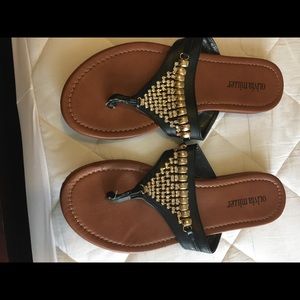 Black jeweled flip flops